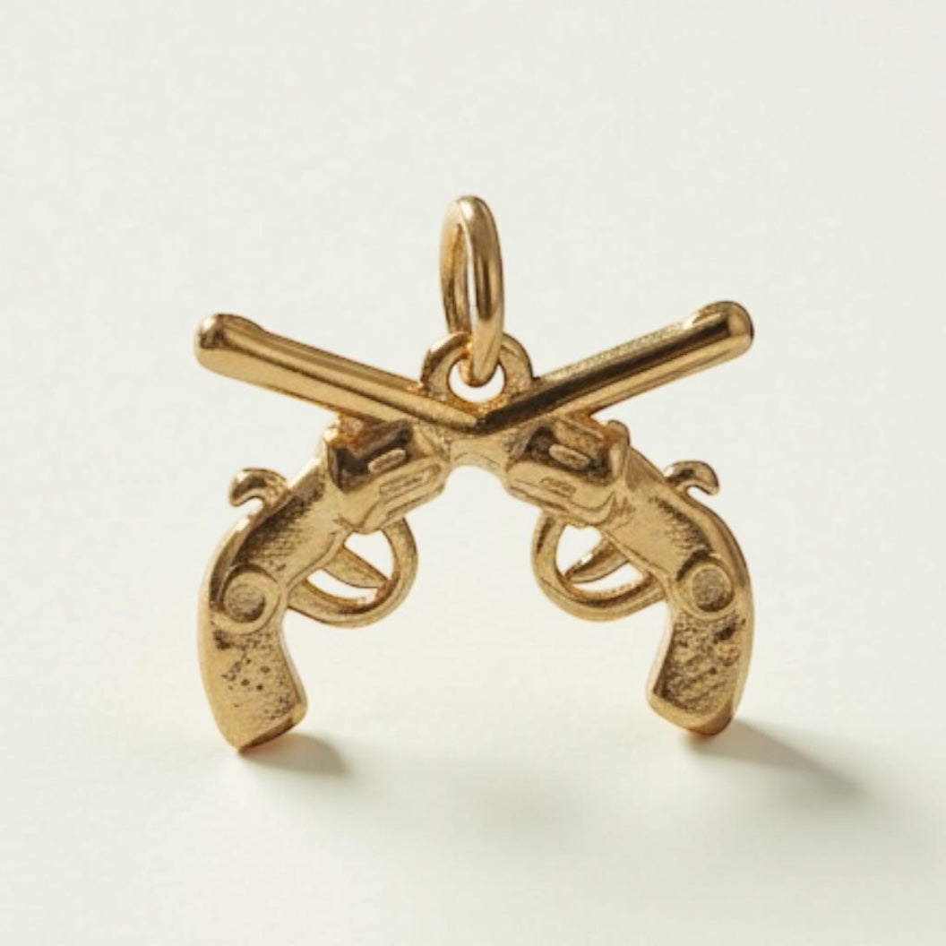 Golden Crossed Pistols Brass Pendant – Bold Symbol of Strength, Power & Rebellion 🔥✨