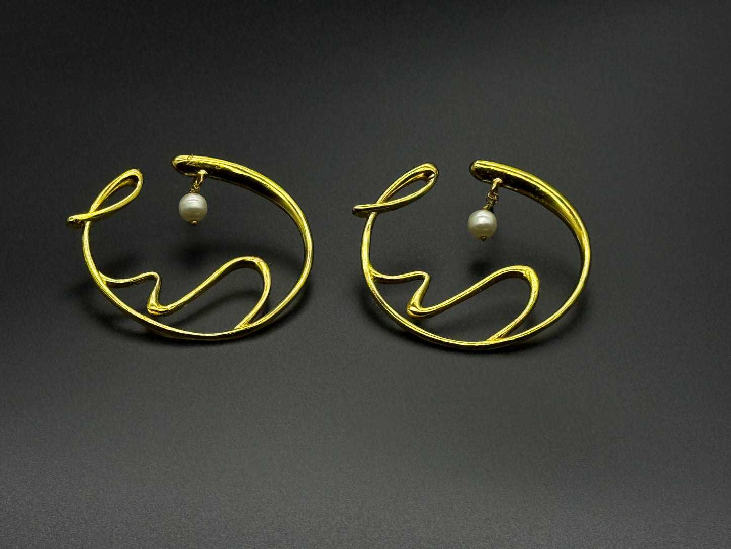 Golden Wave Brass Earrings with Pearl Drop – Modern Art-Inspired Statement Jewelry