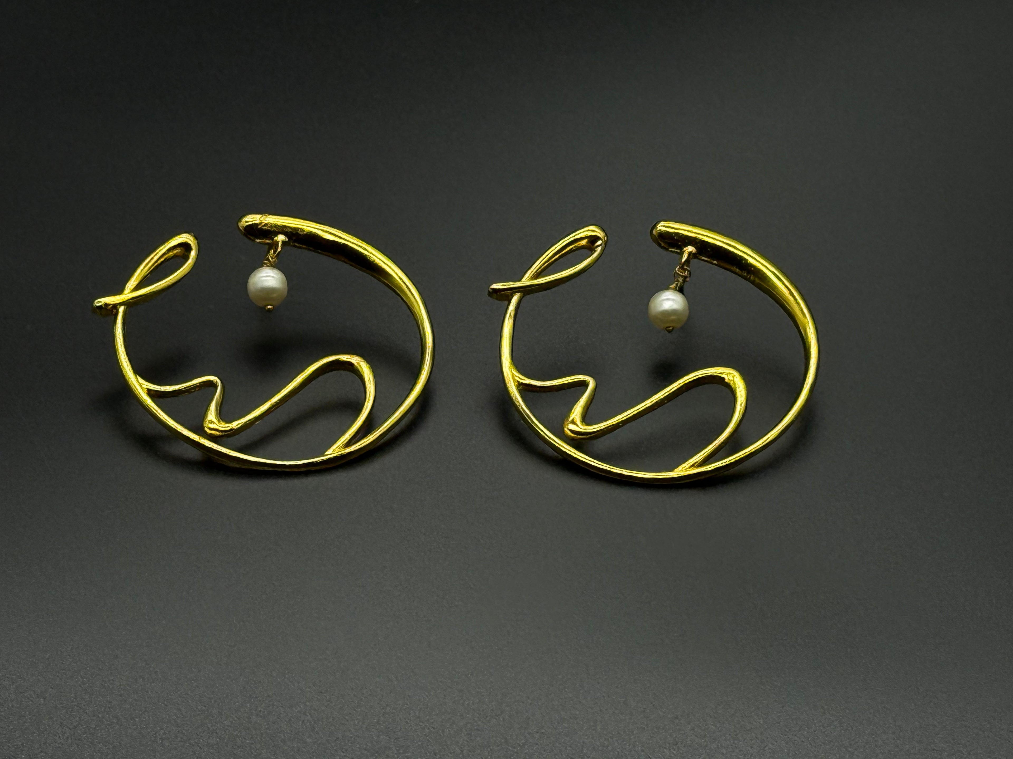 Golden Wave Brass Earrings with Pearl Drop – Modern Art-Inspired Statement Jewelry