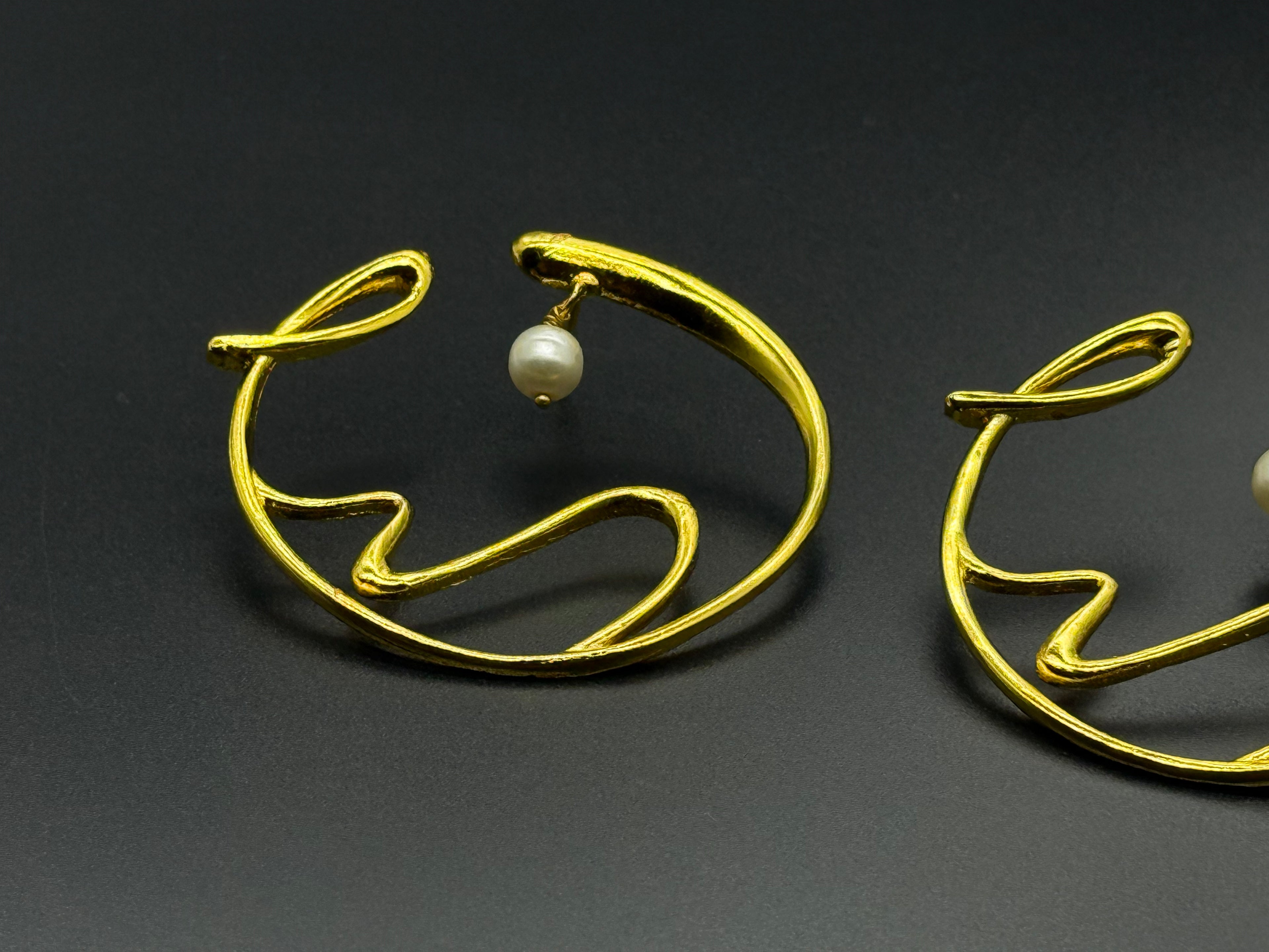 Golden Wave Brass Earrings with Pearl Drop – Modern Art-Inspired Statement Jewelry