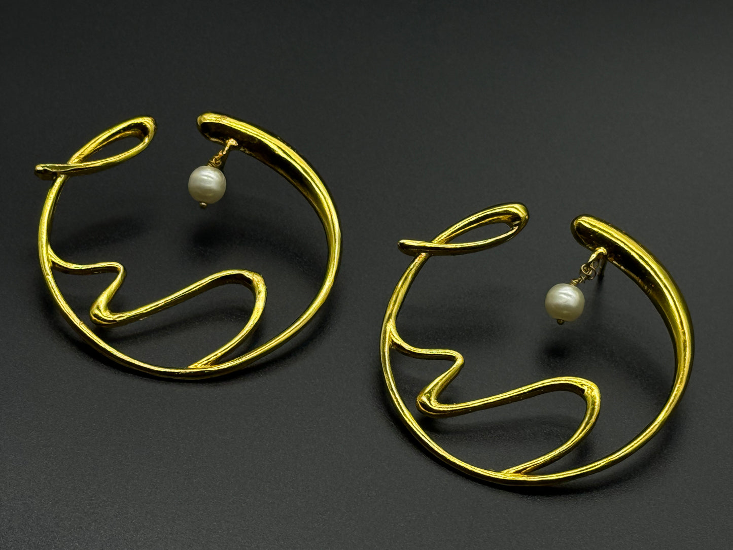 Golden Wave Brass Earrings with Pearl Drop – Modern Art-Inspired Statement Jewelry