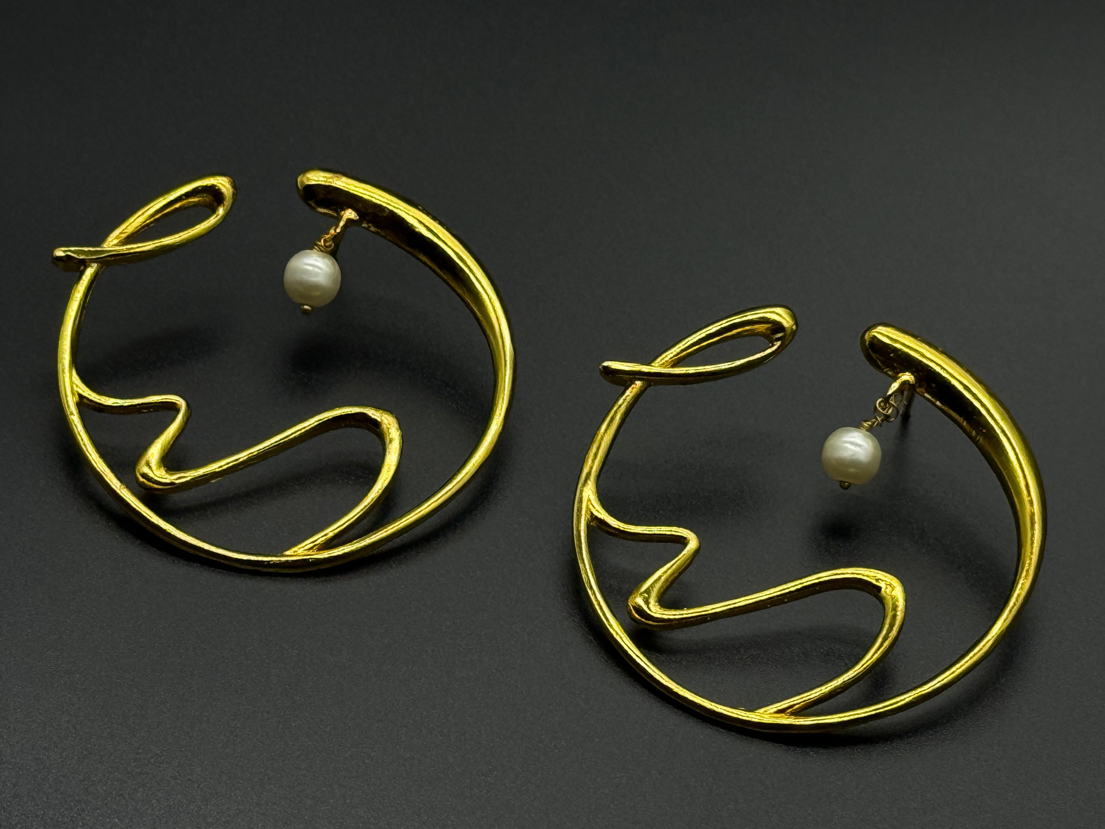 Golden Wave Brass Earrings with Pearl Drop – Modern Art-Inspired Statement Jewelry